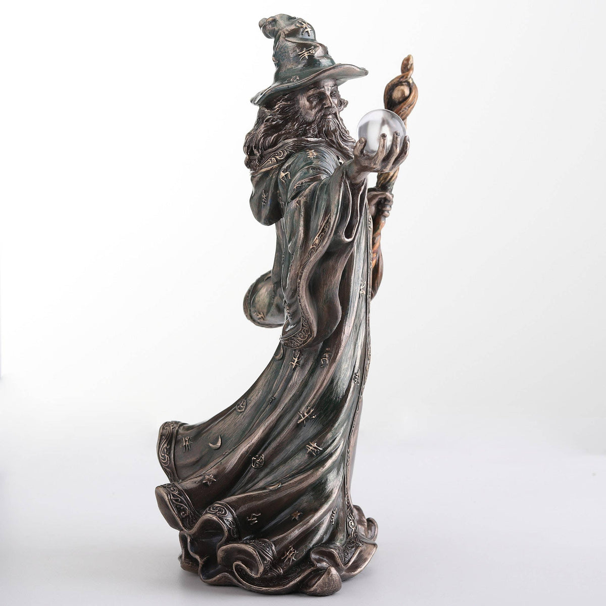 Wizard Holding Crystal Ball And Staff