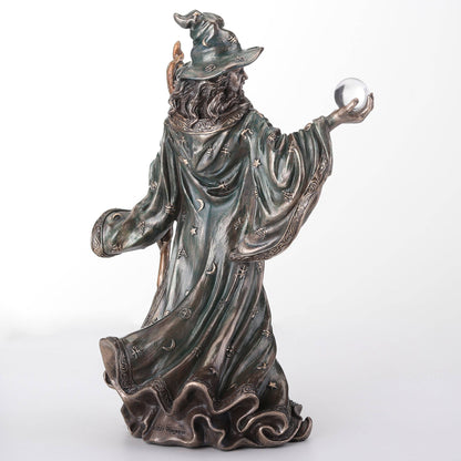 Wizard Holding Crystal Ball And Staff