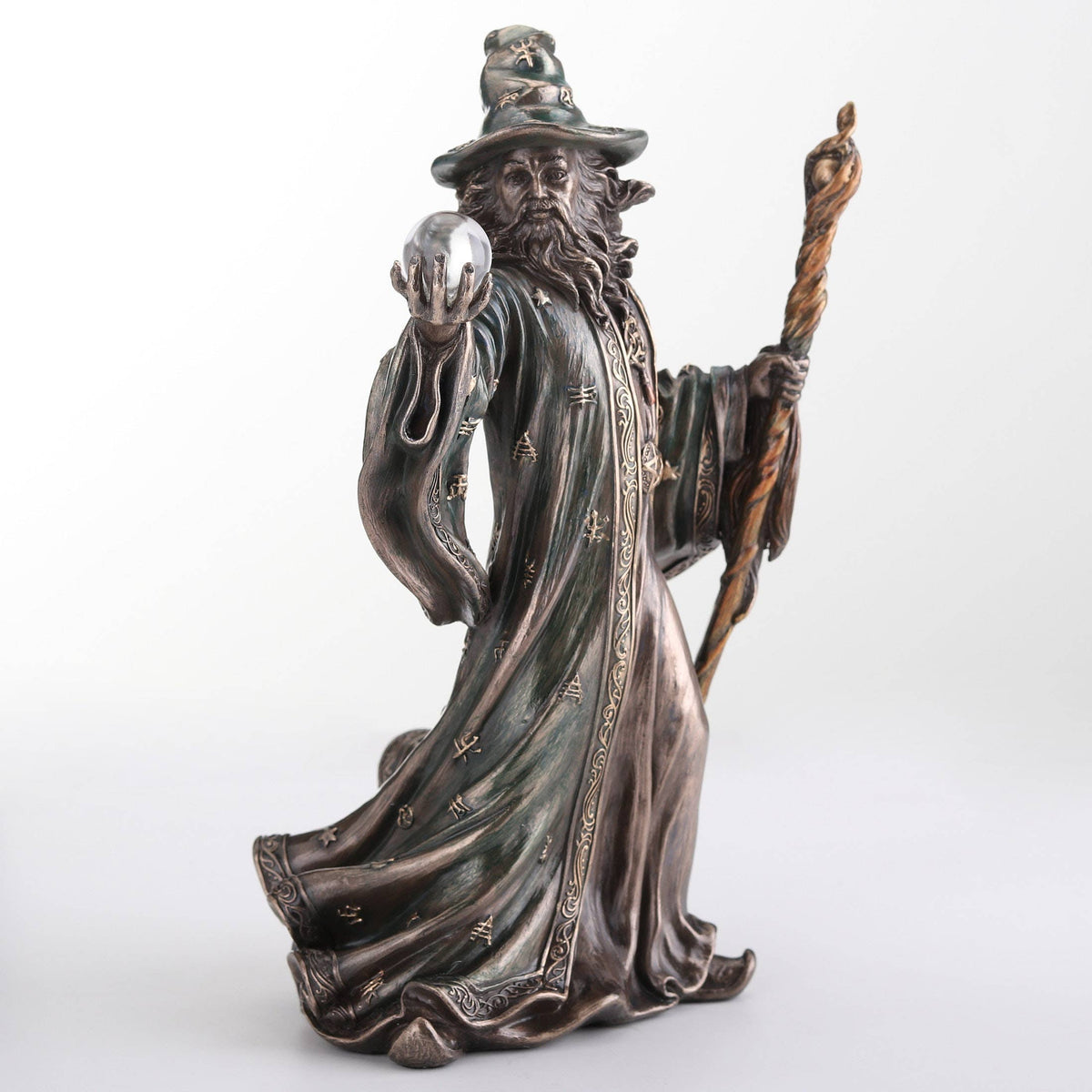 Wizard Holding Crystal Ball And Staff