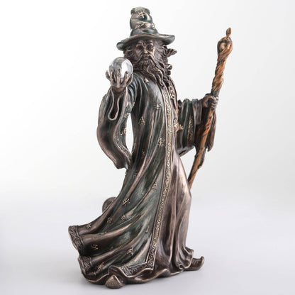 Wizard Holding Crystal Ball And Staff