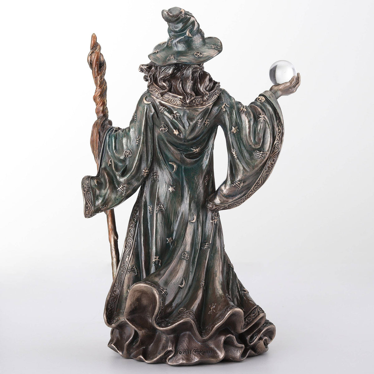 Wizard Holding Crystal Ball And Staff
