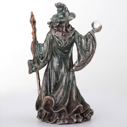 Wizard Holding Crystal Ball And Staff