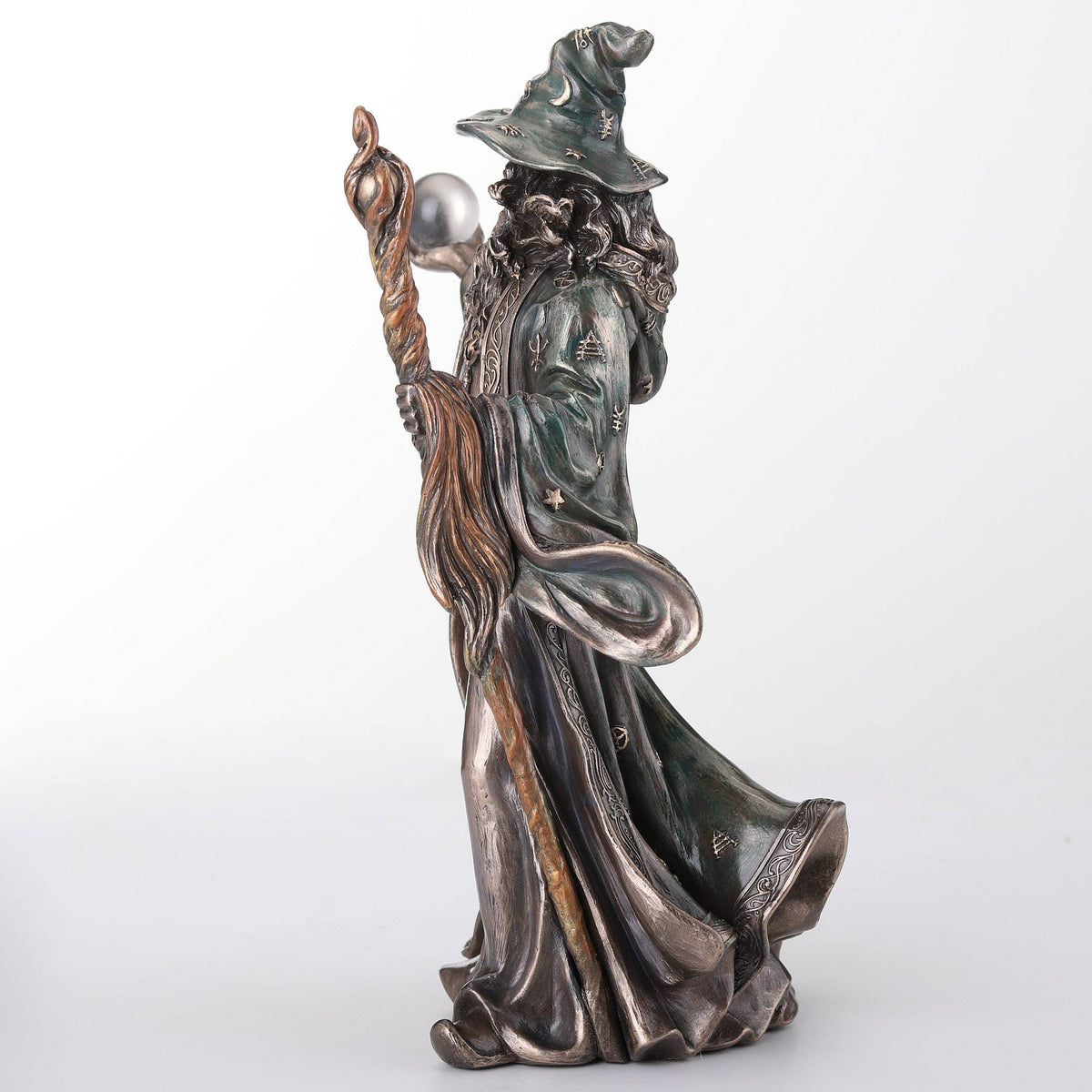 Wizard Holding Crystal Ball And Staff