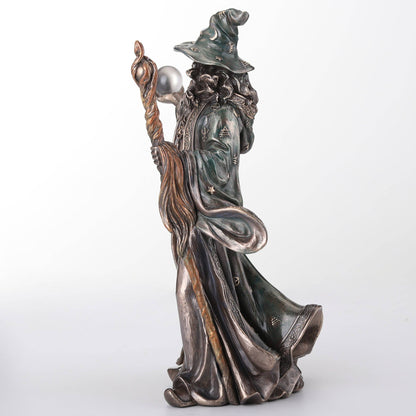 Wizard Holding Crystal Ball And Staff