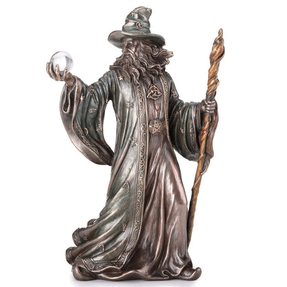 Wizard Holding Crystal Ball And Staff