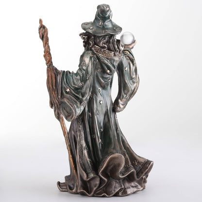 Wizard Holding Crystal Ball And Staff